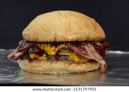 Double steak burger with smoked bacon, cheddar cheese and bbq sauce