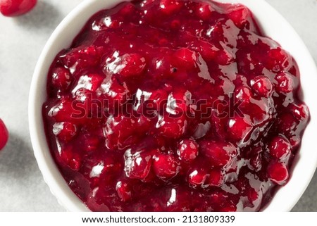 Homemade Sweet Lingonberry Jam in a Bowl Royalty-Free Stock Photo #2131809339