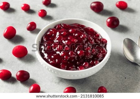 Homemade Sweet Lingonberry Jam in a Bowl Royalty-Free Stock Photo #2131810085