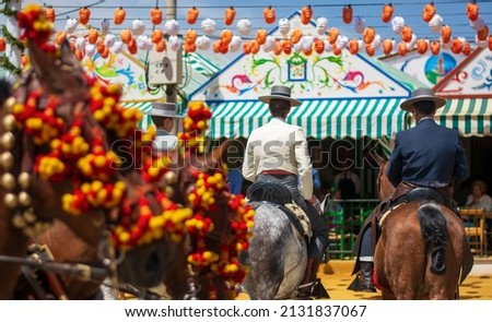 horses and riders at the Spanish fiesta Royalty-Free Stock Photo #2131837067