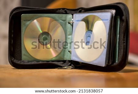 A book for storing CDs.Photo on the desktop of the computer. Background.