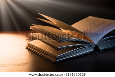 Grunge age dirty rough rustic brown jew psalm pray torah law letter shine dark black wooden desk table space. New culture god Jesus Christ gospel literary library lit glow art wood still life concept Royalty-Free Stock Photo #2131850529