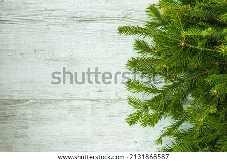 Christmas composition. Christmas tree decorations, fir tree branches on white wooden background. Flat lay, top view, copy space