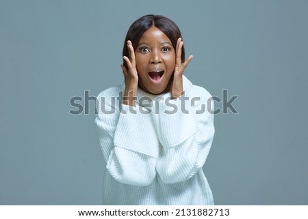 Excited surprised young african american girl opened mouth in astonishment. Incredible online store sale. Wow emotion Royalty-Free Stock Photo #2131882713