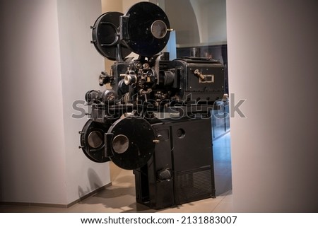 Photo of old vintage movie projector in cinema library.