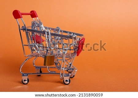 Shopping cart, chained and padlocked

