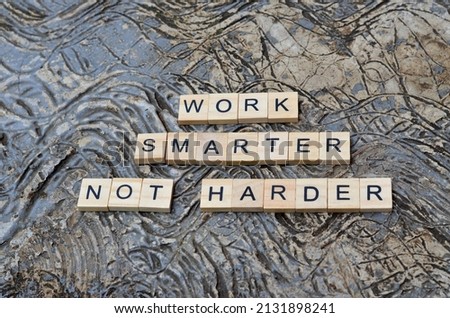 work smarter not harder text on wooden square, business and motivation quotes