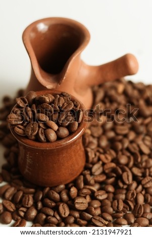 coffee beans with brown mug  with white background - with edit 