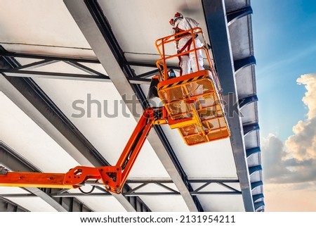 Civil engineer inspection under bridge construction by car lift at sydney city, australia Royalty-Free Stock Photo #2131954211