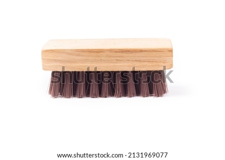Isolated objects: clothes brush with wooden handle, cleaning or care tool, on white background. Royalty-Free Stock Photo #2131969077