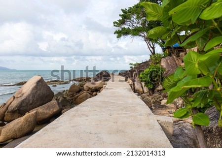 Cement walkway by the sea.