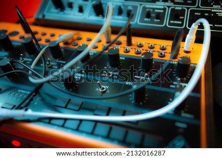 A closeup shot of a Behringer analog semi-modular synthesizer Royalty-Free Stock Photo #2132016287