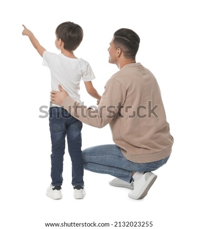 Little boy with his father on white background, back view Royalty-Free Stock Photo #2132023255