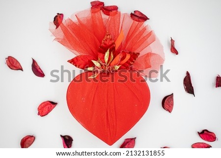 valentine's day gift filled with chocolate on a white background