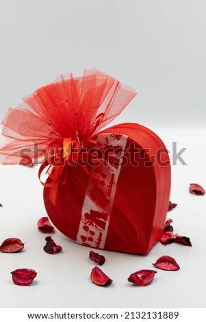 valentine's day gift filled with chocolate on a white background