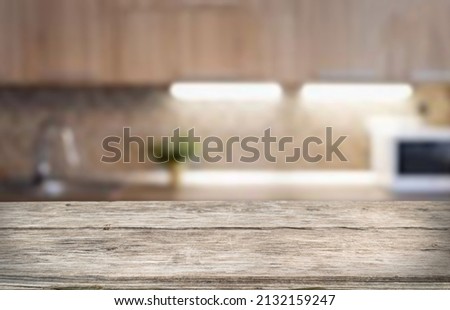 Wood table shelf on blur cooking kitchen background.For montage product display or design key visual layout.Kitchen and cooking concept.View of copy space. Royalty-Free Stock Photo #2132159247
