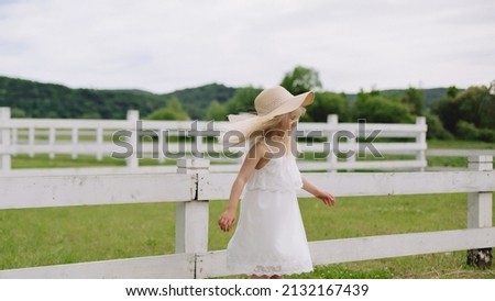 Ukrainian beautiful 7 year old girl in a wheat field. Girl with white hair like an angel.