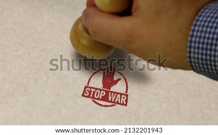 Stop war stamp and stamping hand. Peace, no aggression and pacifism concept.