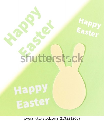 Easter card with lettering and egg bunny on bicolor background, selective focus.