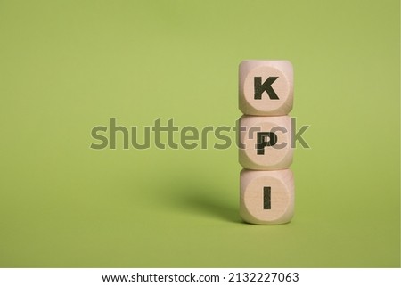 KPI, Key Performance Indicators acronym letters on wooden blocks isolated on light green background copy space Royalty-Free Stock Photo #2132227063