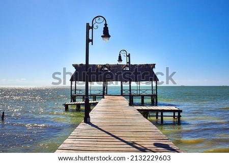balcony in the ocean with lights in the way blue sky , lagoon in isla aguada campeche mexico Royalty-Free Stock Photo #2132229603