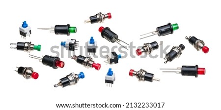 Various miniature push button switches isolated on white panoramic background. Collection of small electronic components with round on or off pushbuttons or metal pins to use in PCB. Electromechanics. Royalty-Free Stock Photo #2132233017