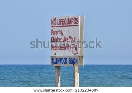 Swimming Safety Sign Posted Stating No Lifeguards Parents Children are Your Responsibility