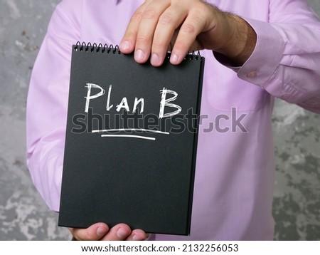 Business concept meaning Plan B with sign on the page.
