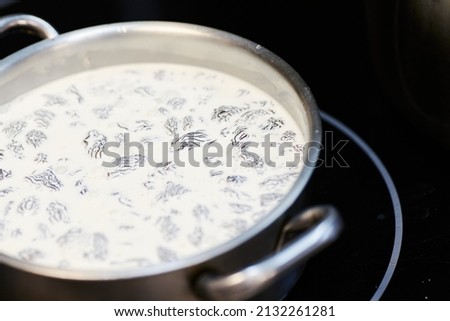 the process of boiling morel mushrooms in milk.