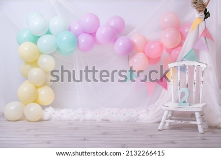 Beautiful rainbow birthday. Colorful balloons. Girl's birthday. Cake smash concept. Photo session in studio. Birthday ideas for kids.