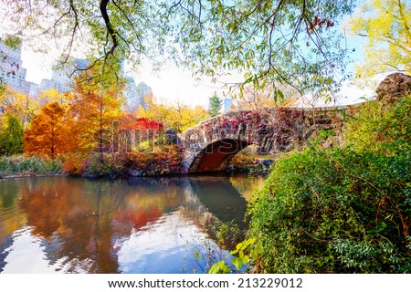 The Gapstow Bridge over The Pond in Central Park, New York, New York, USA, on an autumn day.