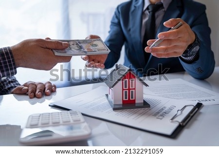 Real estate agents are analyzing insurance discounts. representative has successfully entered into a home loan agreement with the customer. make a deposit and sign the contract home insurance contract