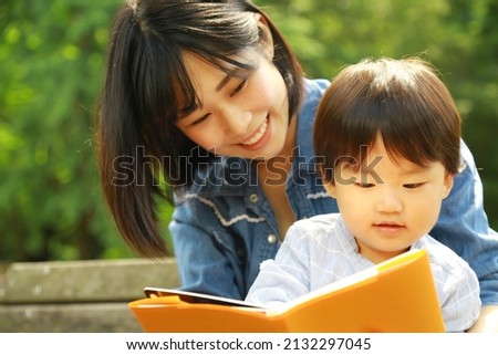 Parents and children reading books 
