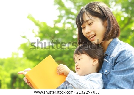 Parents and children reading books 

