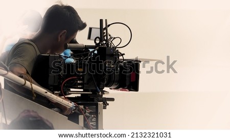 Recording video at studio. Camera records or filming for professional bloggers. Behind the scenes of filming video production. film crew on the set in film studio. Backstage video production recording Royalty-Free Stock Photo #2132321031