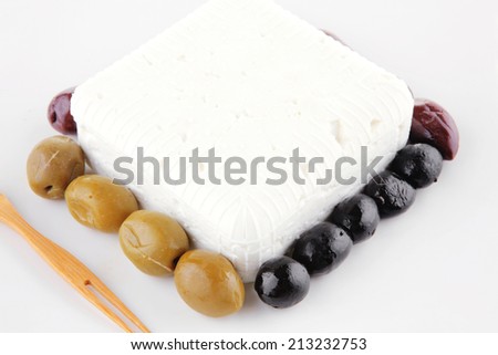 image of soft feta cube with rare olives