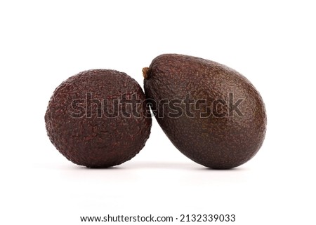 Close-up of two ripe avocados on a white background. Royalty-Free Stock Photo #2132339033