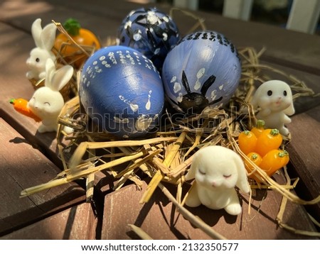 Painted ester eggs and white bunnies