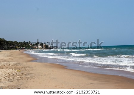Serenity Beach PuducherryIndia- Feb 2022 : Clean beach view in the noon Royalty-Free Stock Photo #2132353721