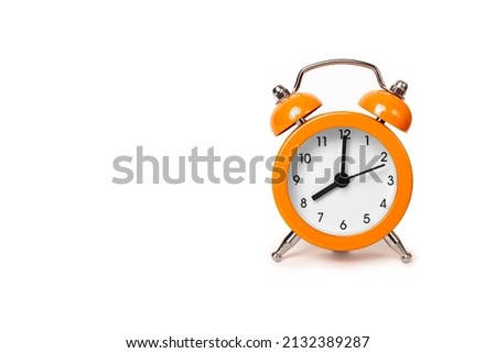 Orange The clock sets the time to 8.00. on white background isolate