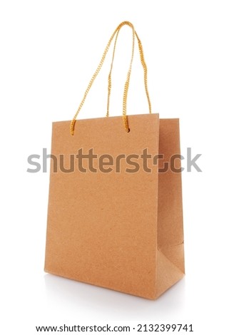 Blank shopping paper bags mockup. Empty cardboard craft bag on a white background. Consumer pack ready for logo design. Shopping and gifts concept. Side view.