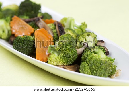 Stir fried Three vegetables (broccoli, mushroom, carrot) on the plate (Selective Focus) 