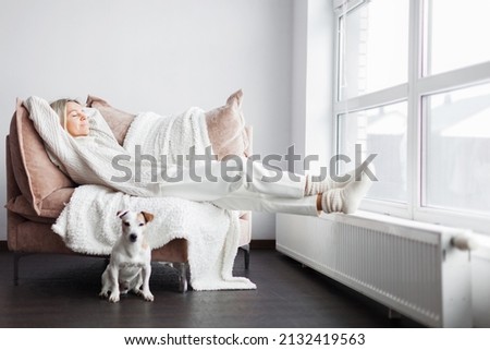 Relaxed serene pretty middle-aged woman feel fatigue lounge on comfortable sofa hands behind head rest at home, happy calm adult lady dream enjoy wellbeing breathing fresh air in cozy home modern room Royalty-Free Stock Photo #2132419563