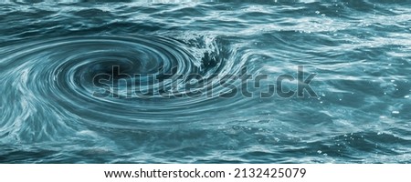 closeup of a water vortex from above, view into the abyss, symbolic concept for gloomy future with copy space, symbol for economic crisis, climate disaster, debt spiral or other calamities  Royalty-Free Stock Photo #2132425079