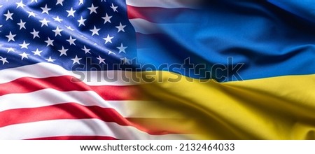 US flag together with Ukrainian flag in a single picture, flags blending one into the other. Royalty-Free Stock Photo #2132464033