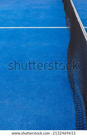 Paddle tennis and tennis court on the blue court. Tennis competition concept. Horizontal sports poster, greeting cards, headers, website. Royalty-Free Stock Photo #2132469615