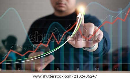 Businessman point growth graph, analyzes profitability of working companies with digital augmented reality graphics, positive indicators businessman calculates financial data for long-term investments