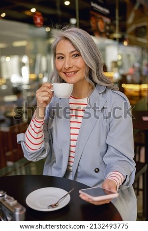 Urban woman during coffee time in cafe