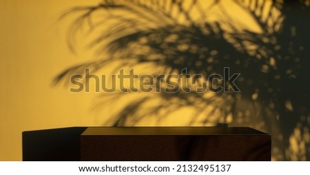 Black display platform and sunset palm leaf shadow background. Empty stage for product promotion.