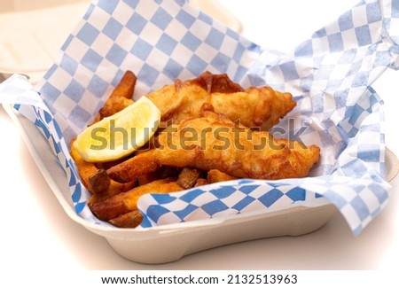 A Meal of Fish and Chips Isolated on a White Background